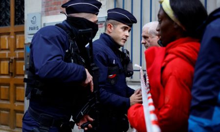 At the scene of the tragic Paris shooting, police use tear gas to disperse protesters