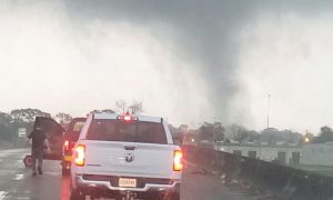 At least three people are killed as ice storms in the US cause tornadoes