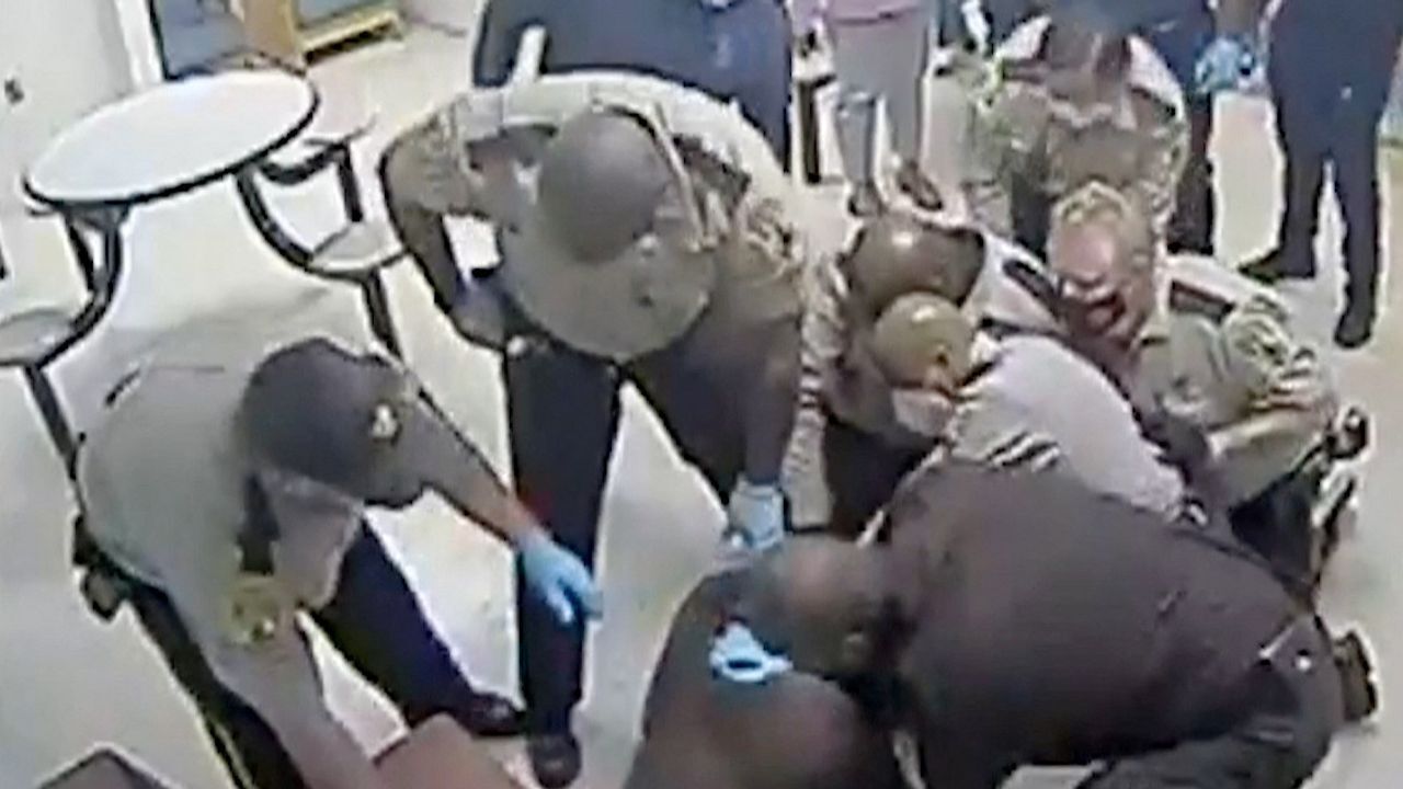 orrifying Moment US Police Smother Innocent Man to Death Caught on Camera